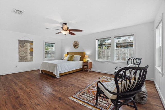 bedroom featuring dark hardwood / wood-style floors and ceiling fan