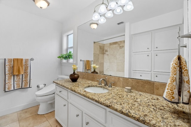 2108 Glendale Pl, Austin, TX 78704 - bathroom with toilet, vanity, a tile shower, tile patterned flooring, and baseboards