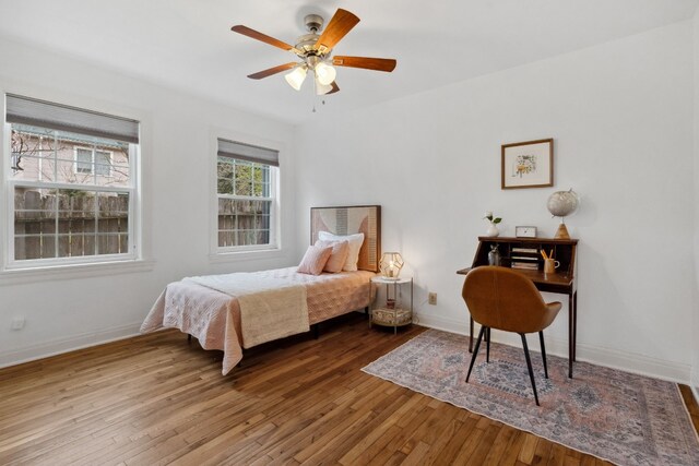 bedroom with hardwood / wood-style flooring and ceiling fan