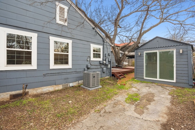 2108 Glendale Pl, Austin, TX 78704 - view of side of property featuring cooling unit, a wooden deck, crawl space, and an outbuilding