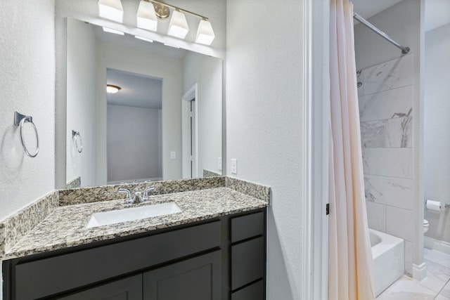 full bathroom with vanity, toilet, and shower / tub combo