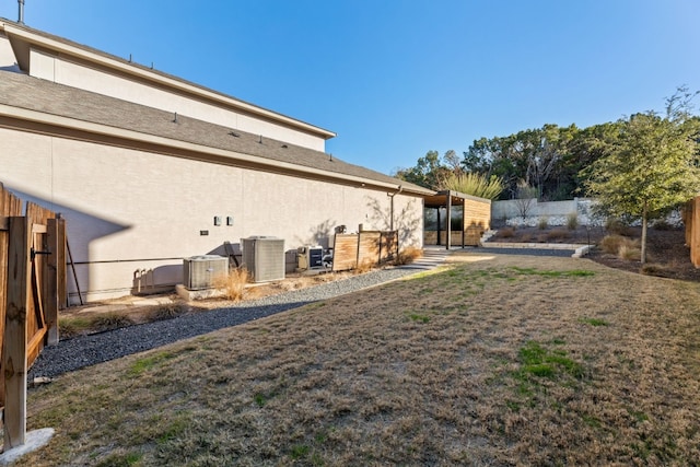 view of yard with central AC