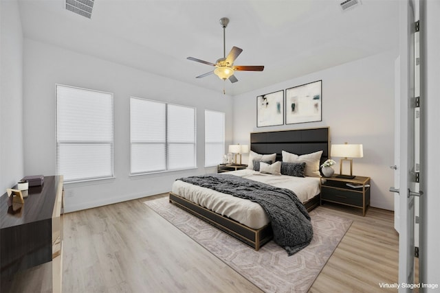 bedroom featuring ceiling fan and light hardwood / wood-style flooring