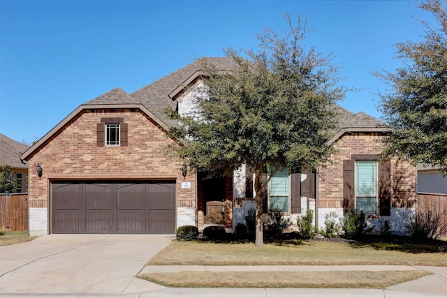 view of front of house featuring a garage and a front yard