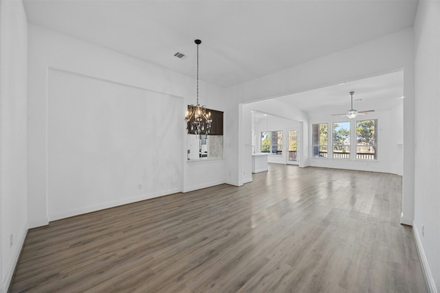 unfurnished living room with hardwood / wood-style flooring and ceiling fan with notable chandelier