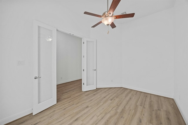 spare room with ceiling fan and light hardwood / wood-style floors