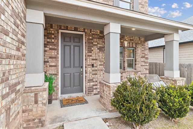 property entrance featuring covered porch