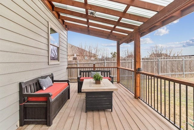 wooden terrace featuring outdoor lounge area and a pergola