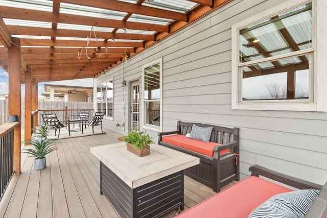 deck featuring an outdoor living space and a pergola