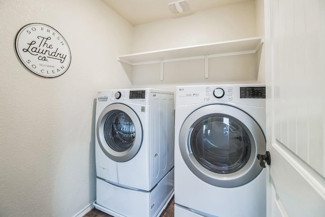 laundry area featuring washing machine and dryer