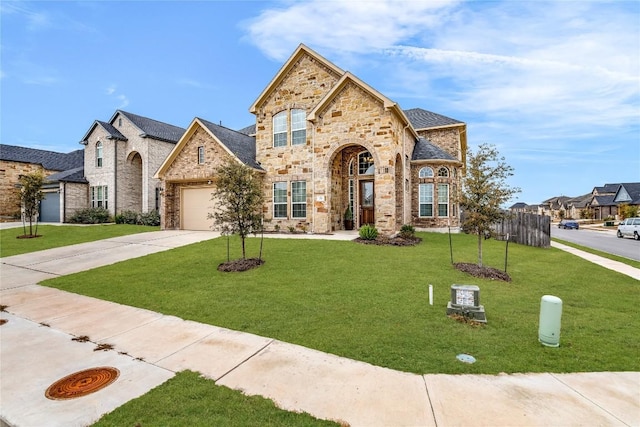 view of front of house with a garage and a front lawn