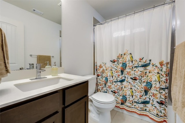 bathroom featuring vanity, tile patterned flooring, a shower with curtain, and toilet