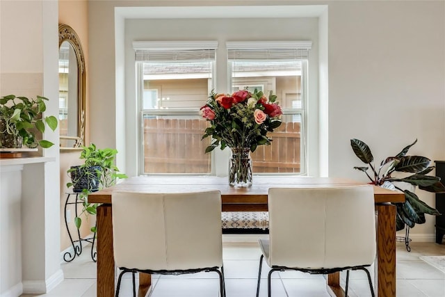 dining space with light tile patterned floors