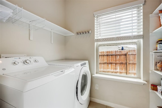 clothes washing area featuring washing machine and dryer