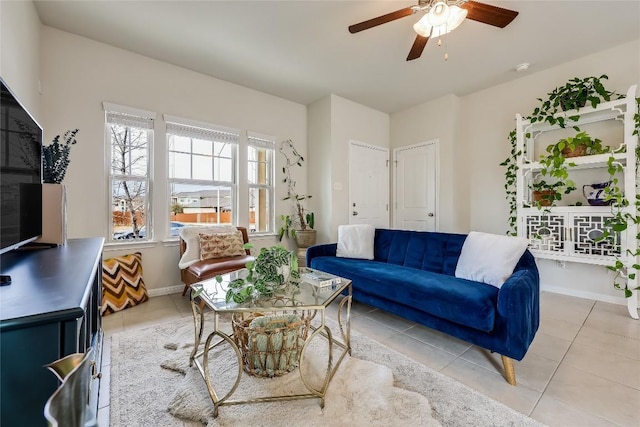 living room featuring light tile patterned flooring and ceiling fan