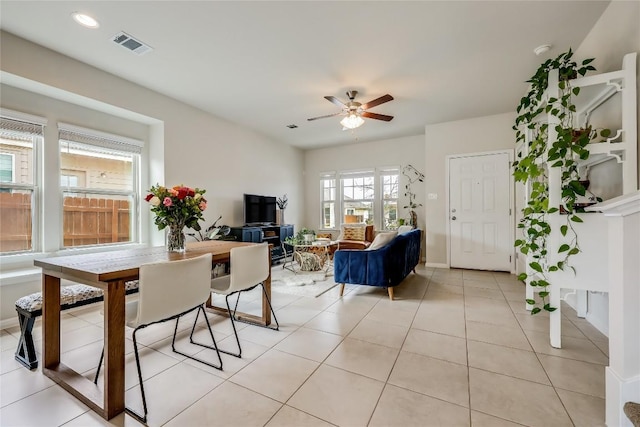 tiled dining room featuring ceiling fan