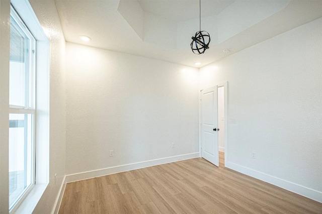 spare room with light hardwood / wood-style flooring