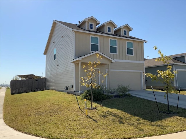 view of front of property featuring a garage and a front lawn