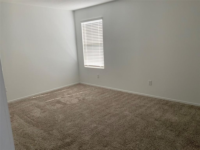 empty room featuring carpet flooring