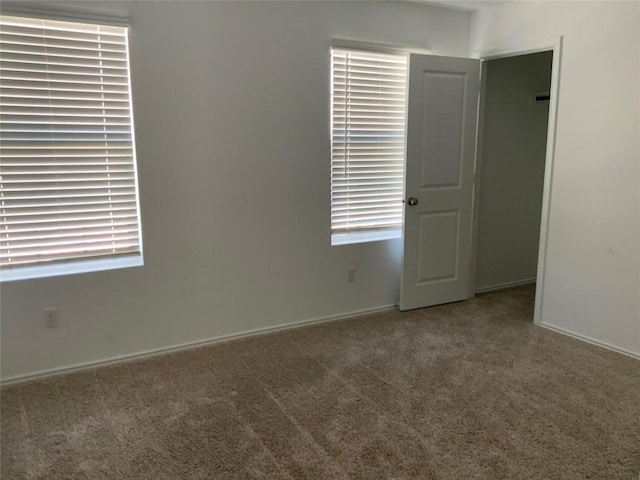 unfurnished room featuring carpet floors