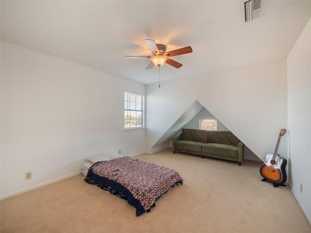 bedroom with ceiling fan and light colored carpet