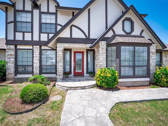 1822 Rowe Loop, Pflugerville, TX 78660 - view of front facade featuring stucco siding and stone siding