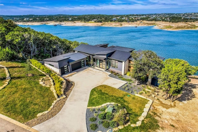 birds eye view of property with a water view