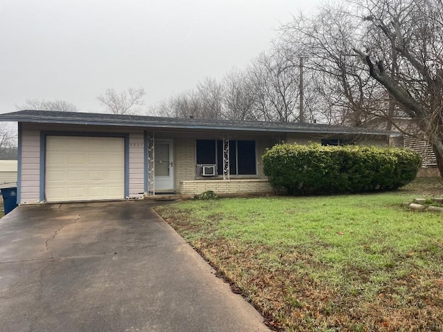 ranch-style home with cooling unit, a garage, and a front lawn