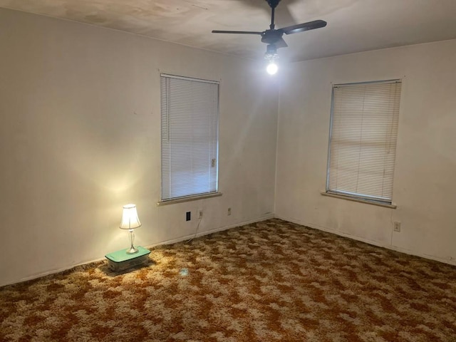 empty room with carpet and ceiling fan