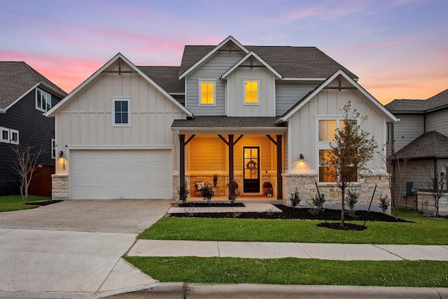 view of front of house with an attached garage, a porch, board and batten siding, and concrete driveway