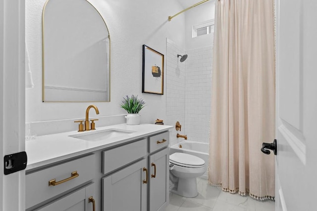 bathroom featuring toilet, marble finish floor, vanity, and shower / bathtub combination with curtain