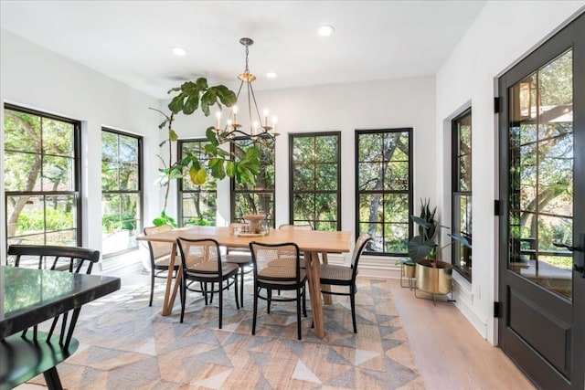 sunroom with a notable chandelier