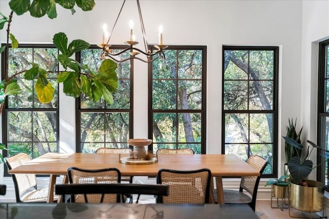 interior space featuring a wealth of natural light and an inviting chandelier