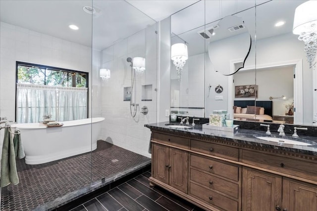 bathroom featuring vanity and plus walk in shower