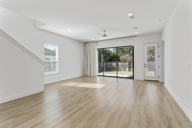 unfurnished room featuring ceiling fan and light hardwood / wood-style flooring