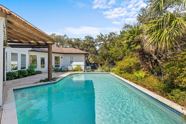 view of swimming pool featuring a pergola and a patio area