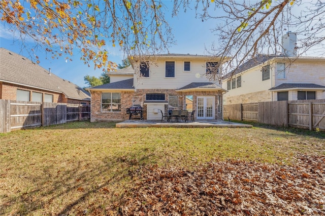 16805 Willow Oak Ln, Round Rock, TX 78681 - rear view of house featuring french doors, a patio, and brick siding