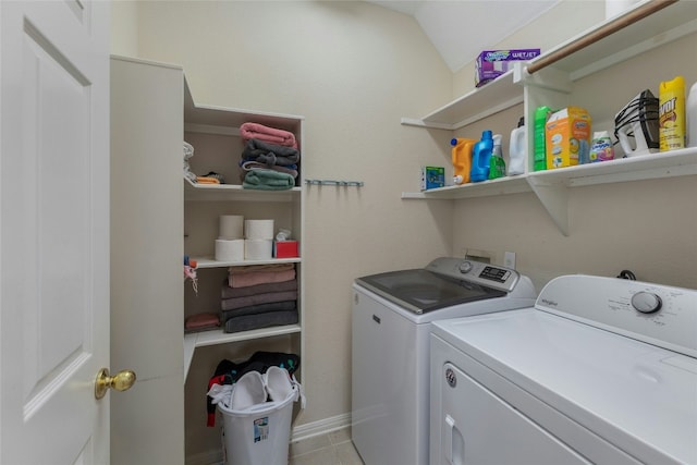 laundry room with light tile patterned flooring and independent washer and dryer