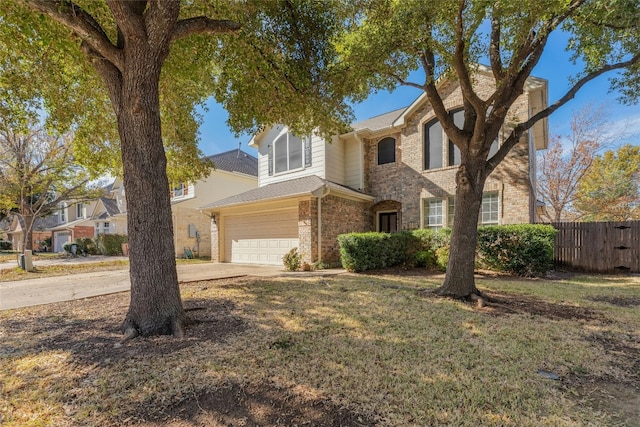 view of front of house with a garage and a front yard