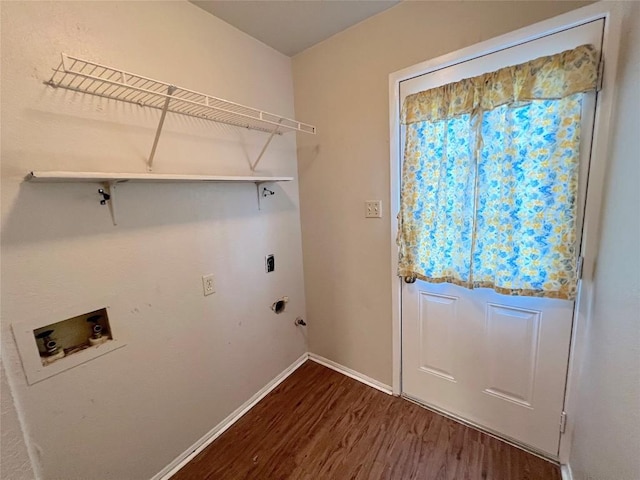 clothes washing area featuring electric dryer hookup, dark hardwood / wood-style floors, and washer hookup