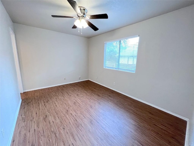 empty room featuring wood-type flooring and ceiling fan