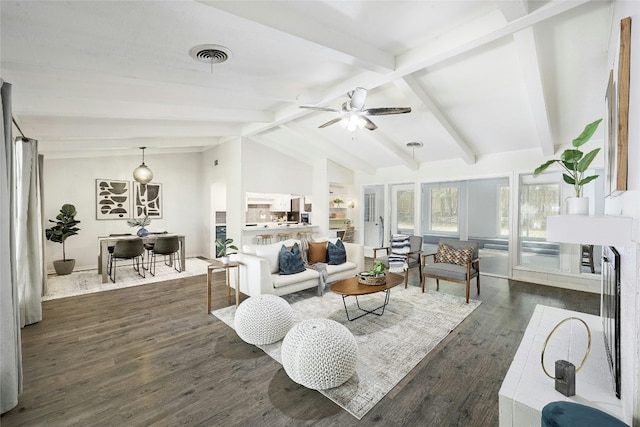 living room with lofted ceiling with beams, dark hardwood / wood-style floors, and ceiling fan