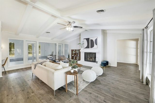 living room featuring dark wood-type flooring, ceiling fan, and lofted ceiling with beams