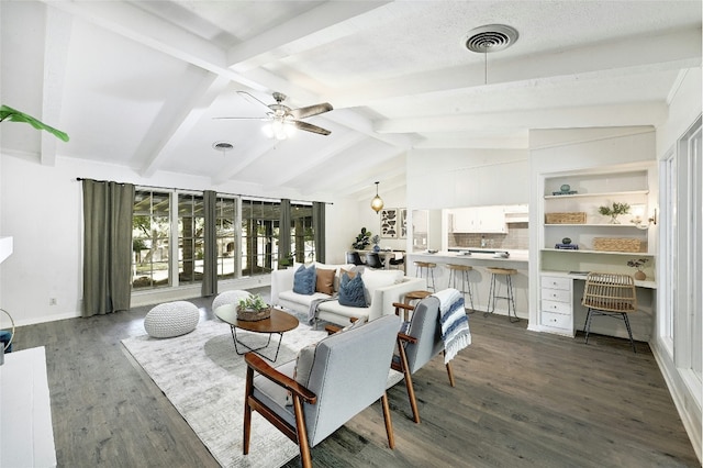 living room featuring dark hardwood / wood-style floors, vaulted ceiling with beams, and ceiling fan