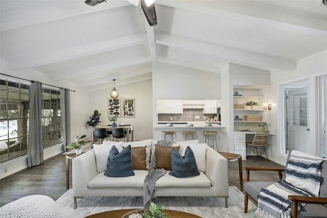 living room with vaulted ceiling with beams and dark hardwood / wood-style floors