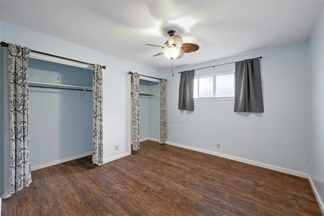 unfurnished bedroom featuring ceiling fan and dark hardwood / wood-style flooring