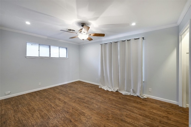 empty room with ornamental molding, dark hardwood / wood-style floors, and ceiling fan