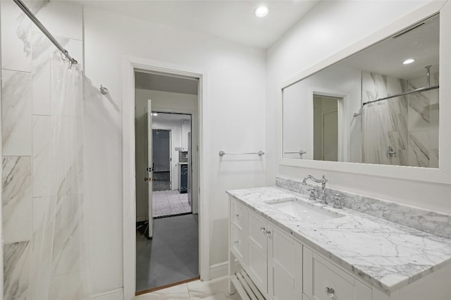 bathroom featuring vanity and a shower with shower curtain