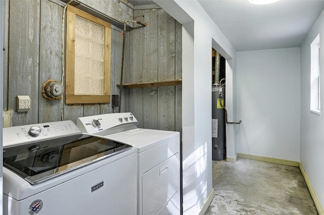 laundry area featuring gas water heater and washing machine and clothes dryer