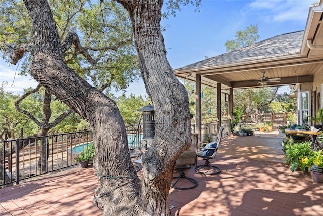 view of patio / terrace featuring a pool side deck and ceiling fan